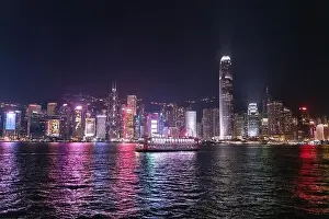 Commercial Hong Prints: The incredible night cityscape view of lights on the water on Victoria Harbour in Hong Kong