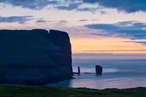Incredible sunrise morning view on Risin og Kellingin cliffs in Atlantic ocean, Eysturoy island, Faroe Islands, Denmark. Landscape photography