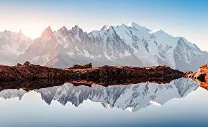 Incredible view of clear water and sky reflection on Chesery lake (Lac De Cheserys) in France Alps. Monte Bianco mountains range on background