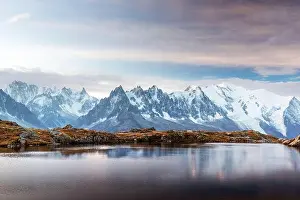 Incredible view of clear water and sky reflection on Chesery lake (Lac De Cheserys) in France Alps. Monte Bianco mountains range on background