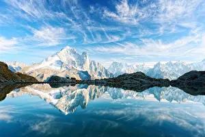 Incredible view of clear water and sky reflection on Lac Blanc lake in France Alps. Monte Bianco mountains range on background