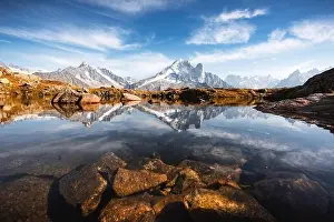 Incredible view of clear water and sky reflection on Lac Blanc lake in France Alps. Monte Bianco mountains range on background