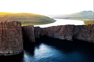 Incredible view of Sorvagsvatn lake on cliffs of Vagar island in sunset time, Faroe Islands, Denmark. Landscape photography