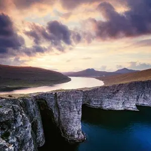 Incredible view of Sorvagsvatn lake on cliffs of Vagar island in sunset time, Faroe Islands, Denmark. Landscape photography