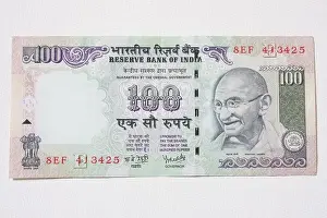 An Indian bank note featuring Mahatma Gandhi of 100 Rupees