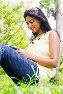 Weekend Activities Prints: indian Beautiful lady park chatting Phone
