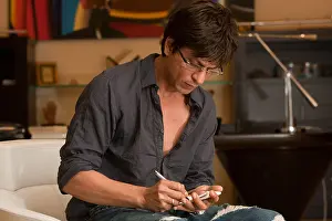 Hindi Prints: Indian bollywood hindi film Actor Shah Rukh Khan in black shirt glasses writing India Asia