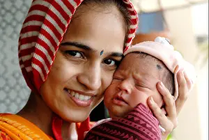 Infants Prints: Indian new born baby with mother touching cheeks India MR#364