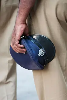 Livelihood Prints: Indian policemans hat in hand. Andhra Pradesh, India