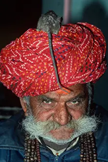 Facial Hair Prints: Indian Priest with a rat on his head at the Deshnoke Temple. Rajasthan, India
