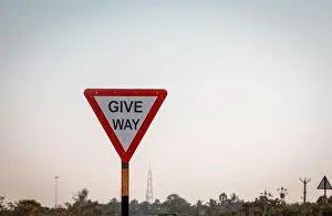 Tamil Nadu Prints: Indian road mandatory sign indicating to give way for the ongoing traffic
