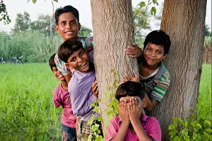 Villager Prints: indian rural children group farm playing Hide and Seek