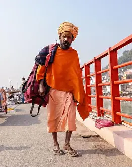 Yogi Prints: Indian Sadhu in traditional saffron dress participating in Kumbh festival
