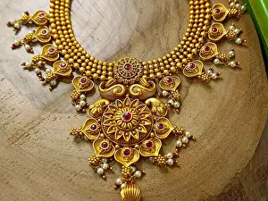 Pendant Prints: Indian Traditional Gold jewellery displayed in a shop for sale in Pune