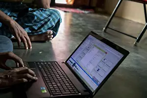 Typing Prints: Indian village people operating laptop