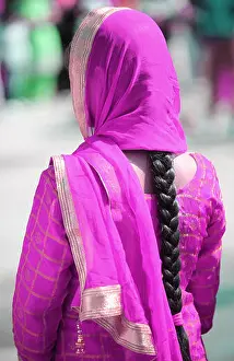 Punjab Prints: Indian woman with purple dress and long black hair