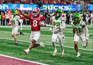 American Football Prints: Indiana Hoosiers running back Kaelon Black (8) runs a touchdown against Oregon during the Chick-fil-A Peach Bowl