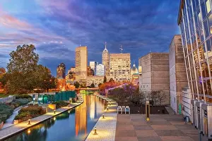 Indianapolis, Indiana, USA downtown cityscape over the river walk at twilight