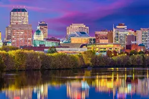 Indianapolis, Indiana, USA skyline on the White River with the state capitol building at dusk