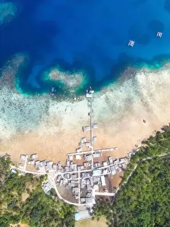 Indonesia Anambas Islands - Drone view Telaga Island coast line with fishing village