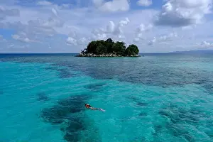 Anambas Islands Prints: Indonesia Anambas Islands - Female snorkeller in coral reef