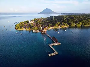 Indonesia Bunaken - Drone view Bunaken Island with coral reef jetty and Manadotua Island