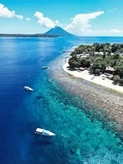 Indonesia Bunaken - Drone view Siladen Island with coral reef