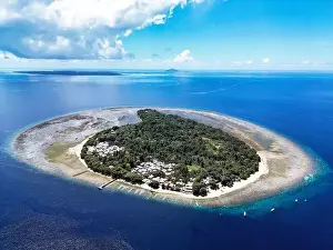 Indonesia Bunaken - Drone view Siladen Island with coral reef