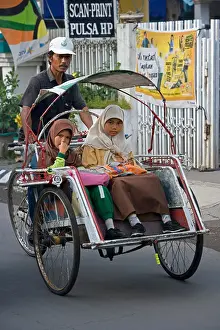 Java Prints: Indonesia, Surabaya, Java, The quarter of Jambangan Cycle rikshaw with two muslim girls