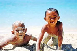 Beach Holiday Prints: indonesian boys playing in the sand