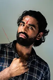 Facial Hair Prints: indoor portrait of a bearded Indian male wearing a man bun