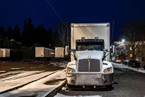 Trucks Prints: Industrial grade white middle duty compact bonnet rig day cab semi truck with box trailer for local deliveries standing