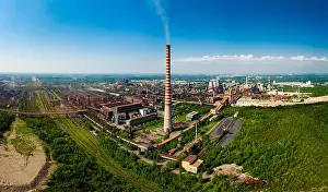 Polluting Prints: Industrial landscape with heavy pollution produced by a large factory