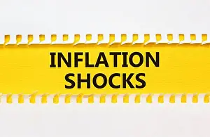 Reduce Prints: Inflation shocks symbol. Concept words Inflation shocks on yellow and white paper