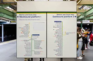 Navigate Prints: Information boards on the platform at South Kensington London Underground Station with maps of the routes for trains