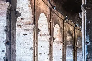 Grandeur Prints: The interior of the Colosseum reveals impressive arches and stonework