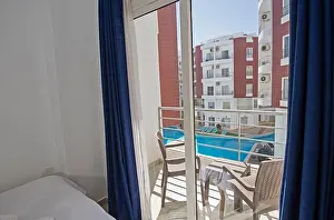 Bedding Prints: Interior design decor furnishing of luxury show home bedroom showing furniture and double bed with balcony