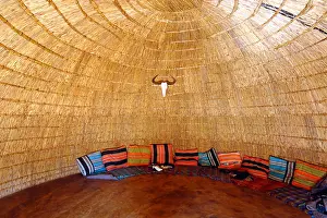 Reed Prints: Interior of a replica zulu hut in the cultural village at Sun City in South Africa