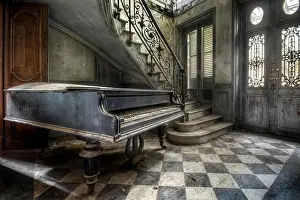 Dirty Prints: Interior view of a hallway with a grand piano and staircase in an abandoned villa in France