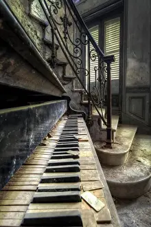 Dirty Prints: Interior view with a piano next to a staircase in an abandoned castle in France