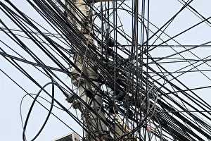 Confusion Prints: many internet cables on lamp post in bucharest romania