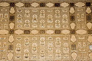 Mandir Prints: Intricate patterns on the mirror covered walls in Jai Mandir The Hall of Victory inside the Amber Fort near Jaipur