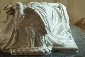 Intricate Prints: Intricately carved Eagle with a snake forming part of a black