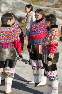 Trousers Prints: Inuit women wearing traditional Greenlandic national costume or Kalaallisuut in Ilulissat on Greenland