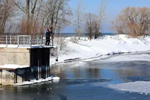 Cold Temperature Prints: Irondequoit, NY, USA - February 22nd 2025 - Bird photographer captures images of bald eagles flying over Lake