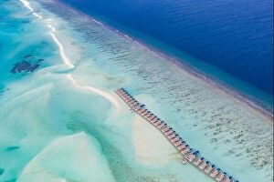 Images Dated 30th May 2019: Island resort in Indian ocean, Maldives. Luxury over water villas bungalow with sandbank