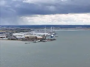 Isle of Grain industrial site powered by wind turbines Kent UK drone, aerial
