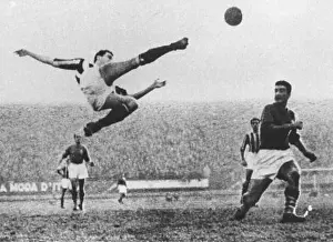 1950 Prints: Italian footballer Carlo Parola of Juventus FC performs a bicycle kick in Florence during a League match against AC
