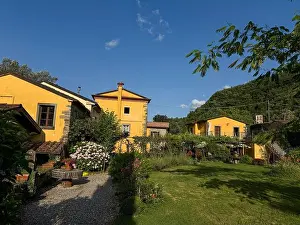 Italian Heritage Prints: Italian garden The 17th Century historic buildings of a watermill in the hamlet of Pisara where water was fed