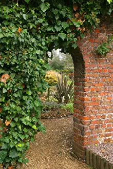 Archway Prints: ivy covered archway with gate and garden beyond